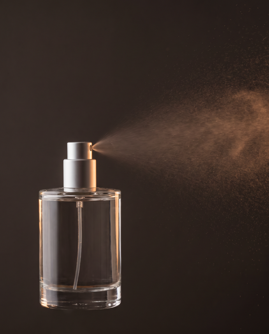 Cologne spray mist fading into the air