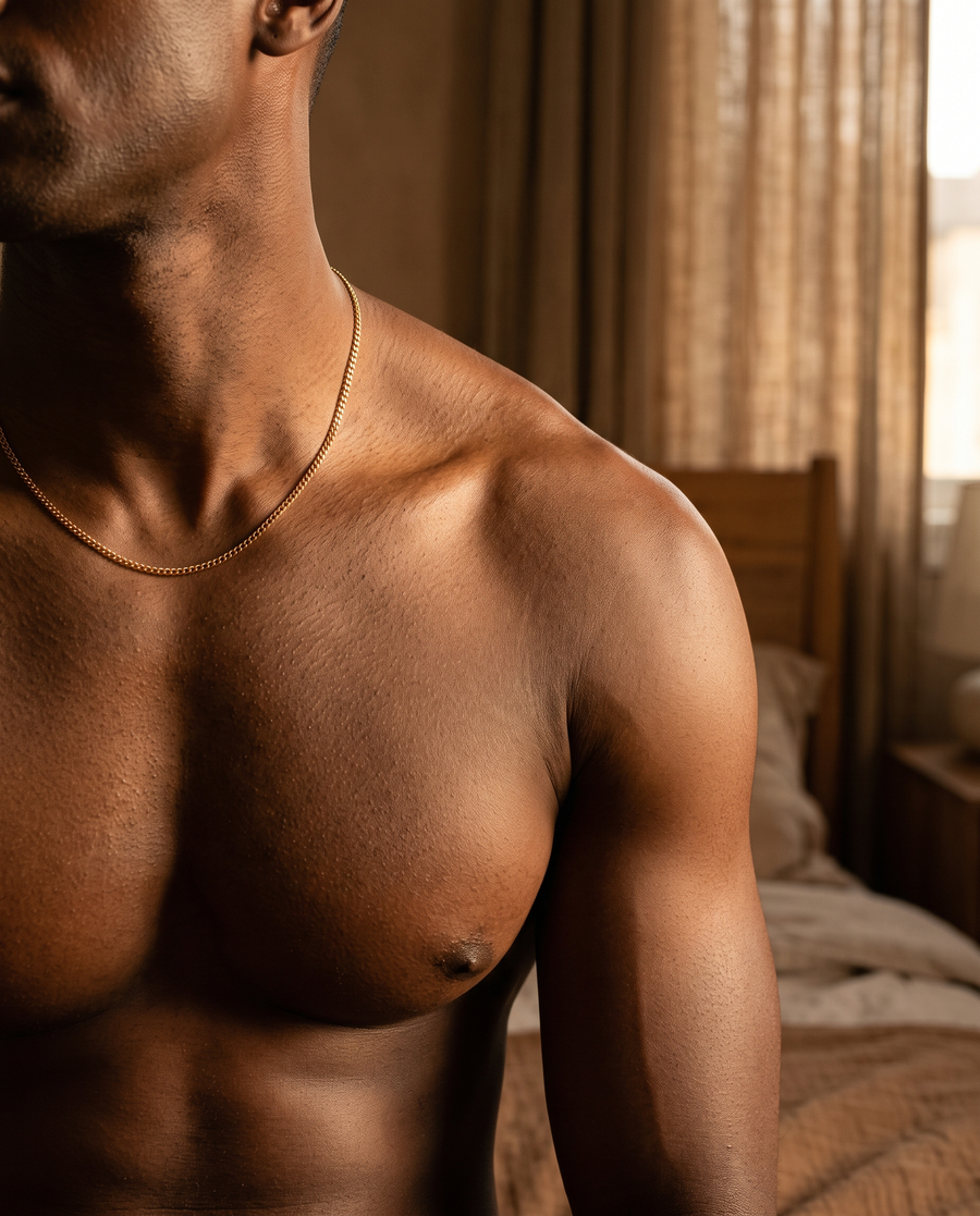 Smooth, moisturized skin on a man's shoulder and chest